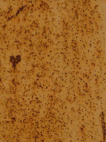 White metal texture, covered by areas of small, deep red rust spots. Several rusted scratches and larger spots are also visible.
